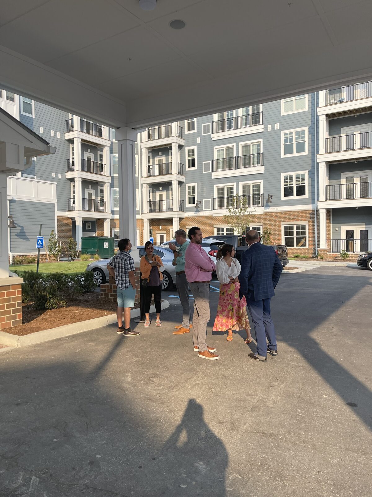 Site visitors touring a DanReDev apartment community exterior