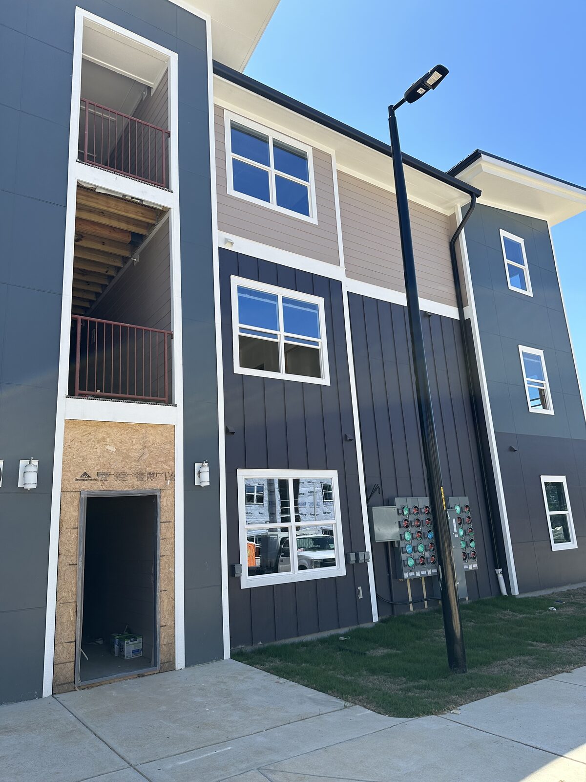 Close-up exterior of a townhome unit under construction