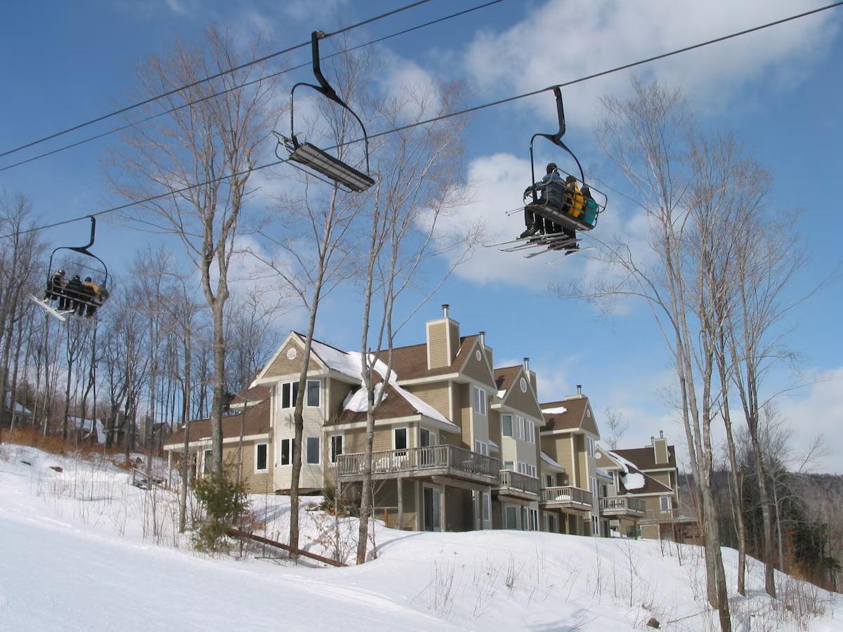A completed DEK Builds ski-in condominium building at a mountain resort