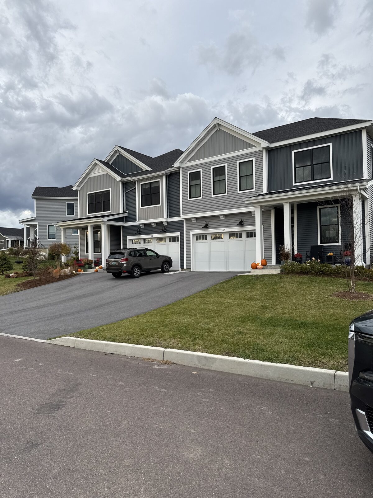 DK Homes townhomes with pumpkins on the porch in autumn