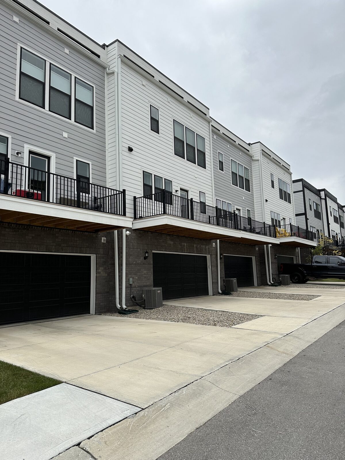 A row of DK Homes townhomes with elevated decks