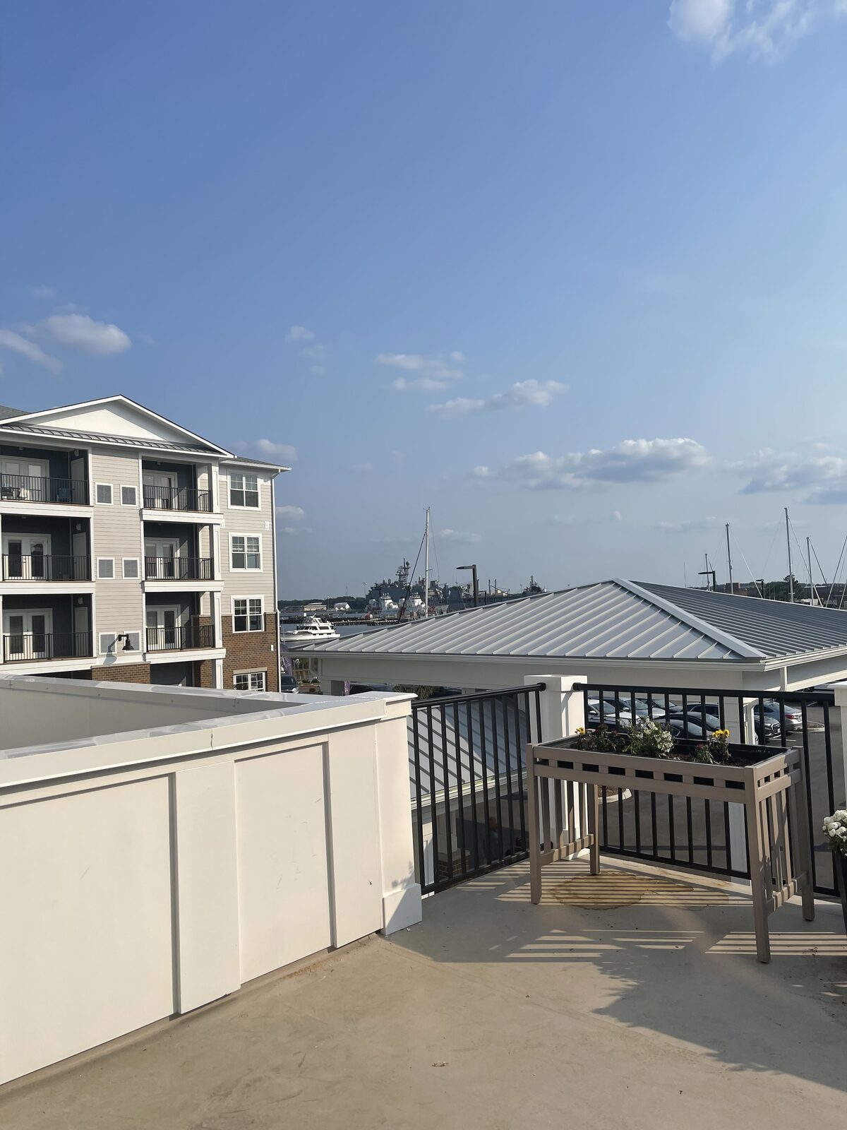 A rooftop deck overlooking a marina
