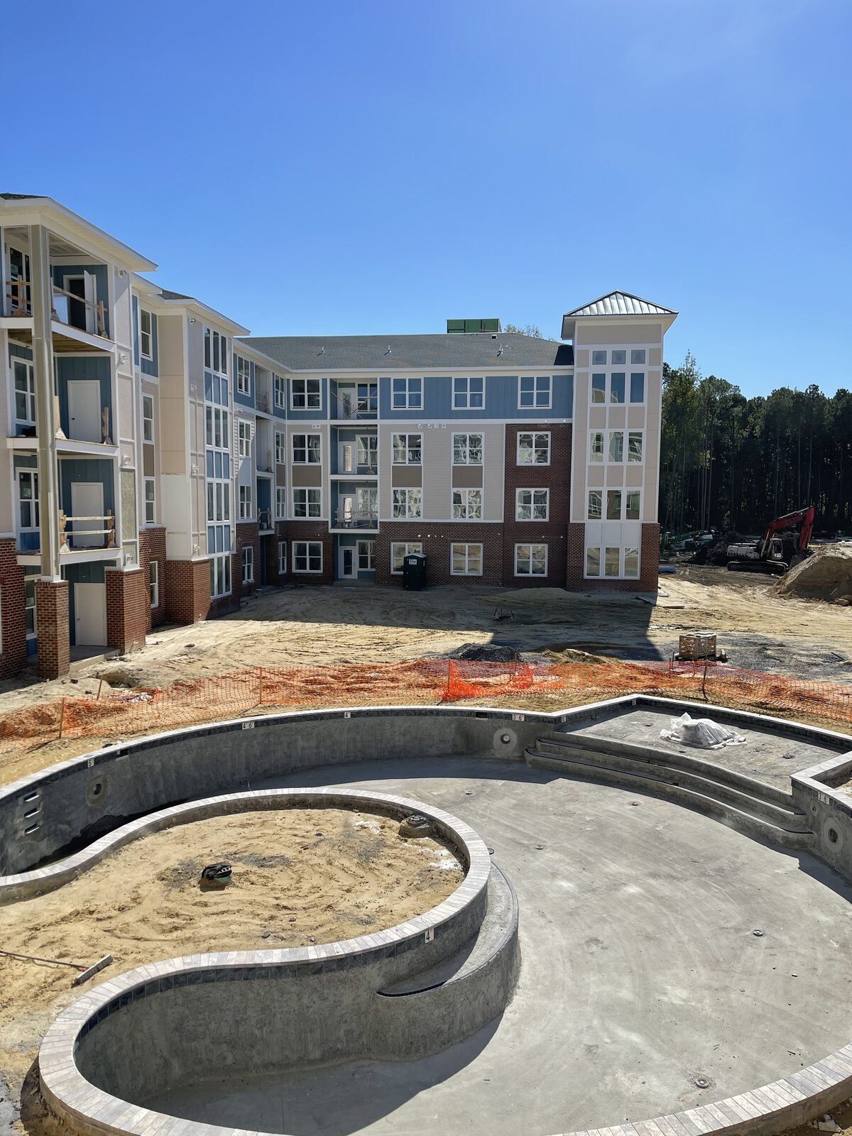 A multi-story townhome building nearing completion
