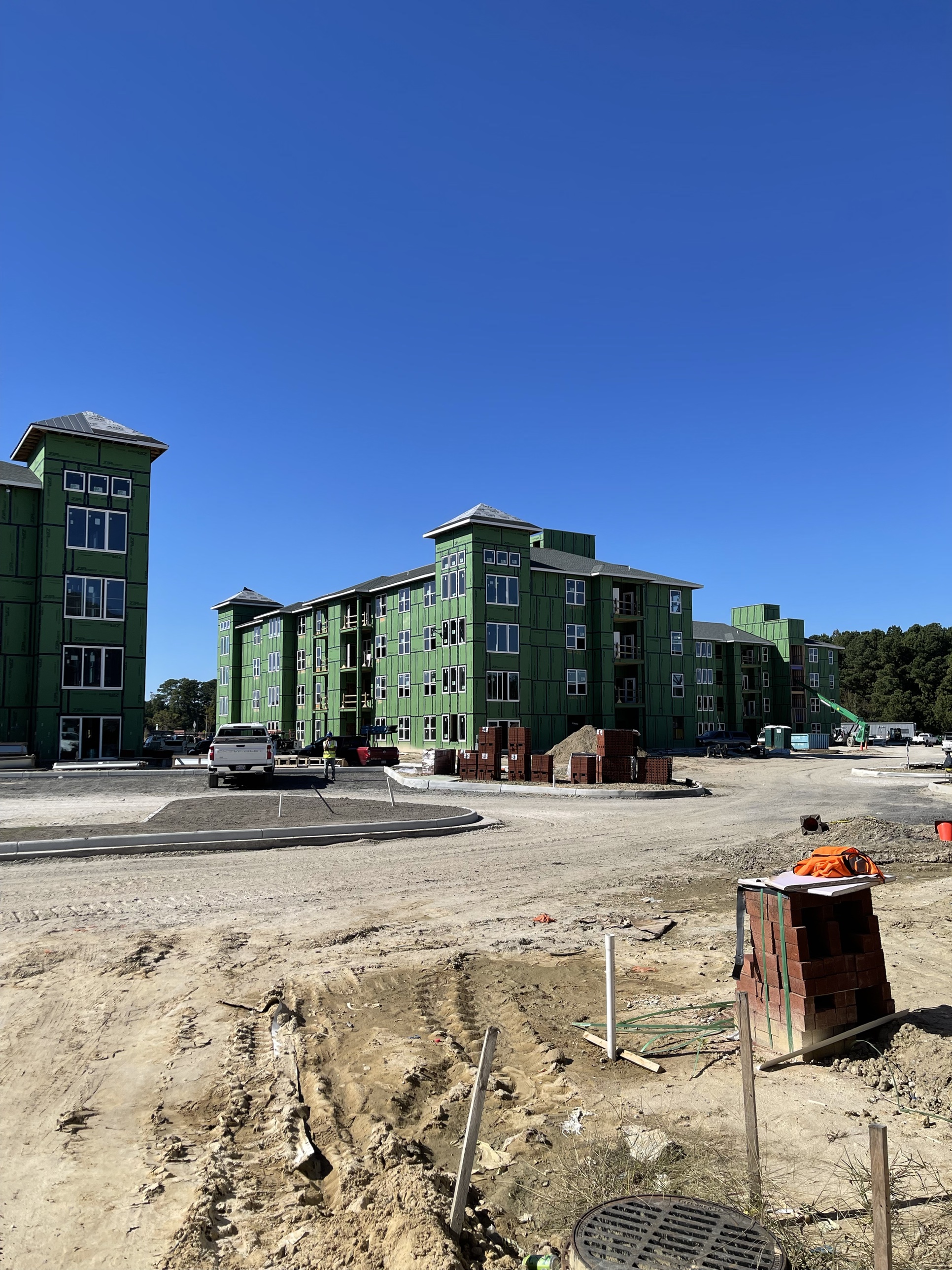 Greenview Residences buildings under construction with materials staged on site