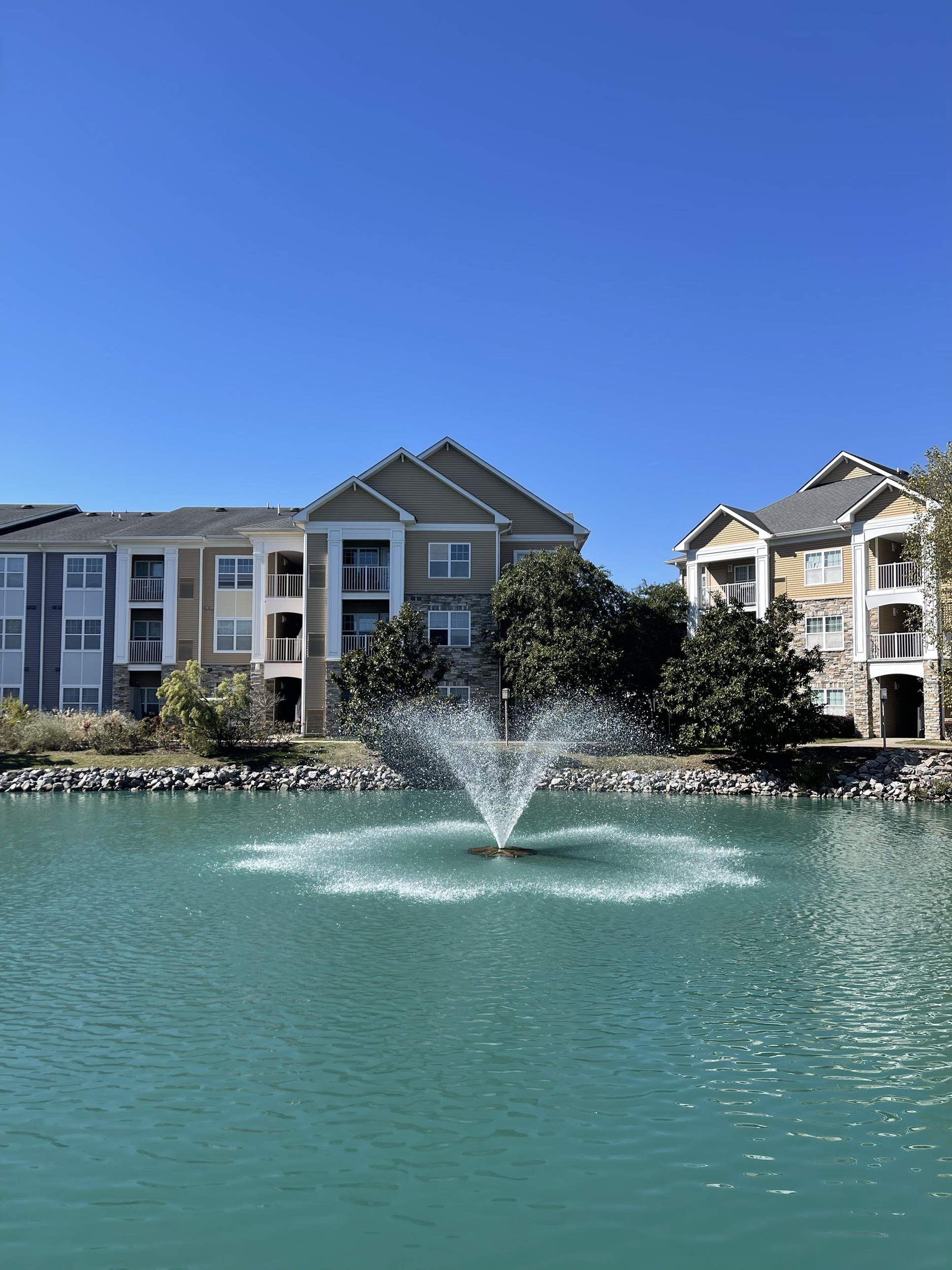 Pond and fountain amenity at the Greenview Residences multifamily community