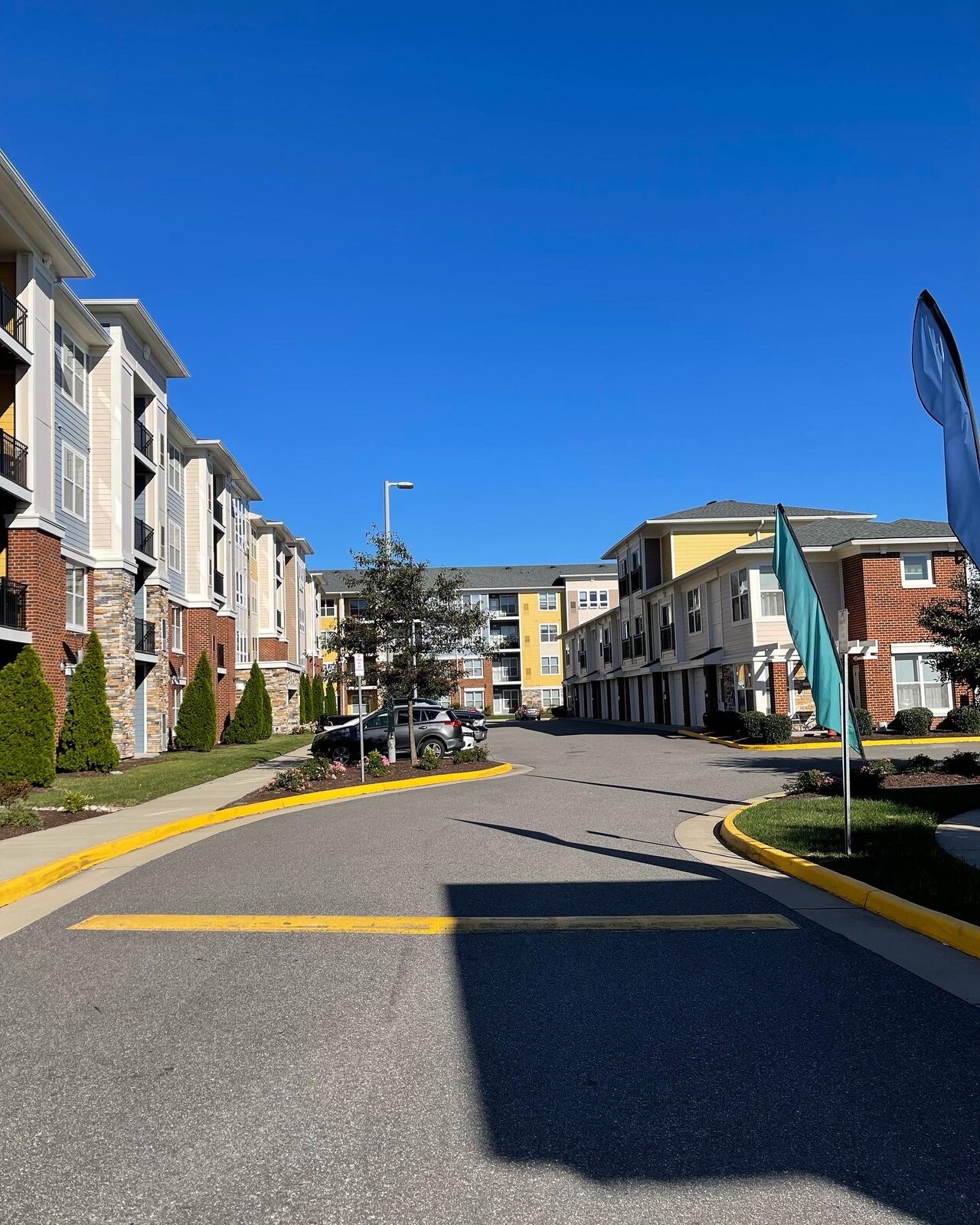 A completed Kaufman Development apartment community street view