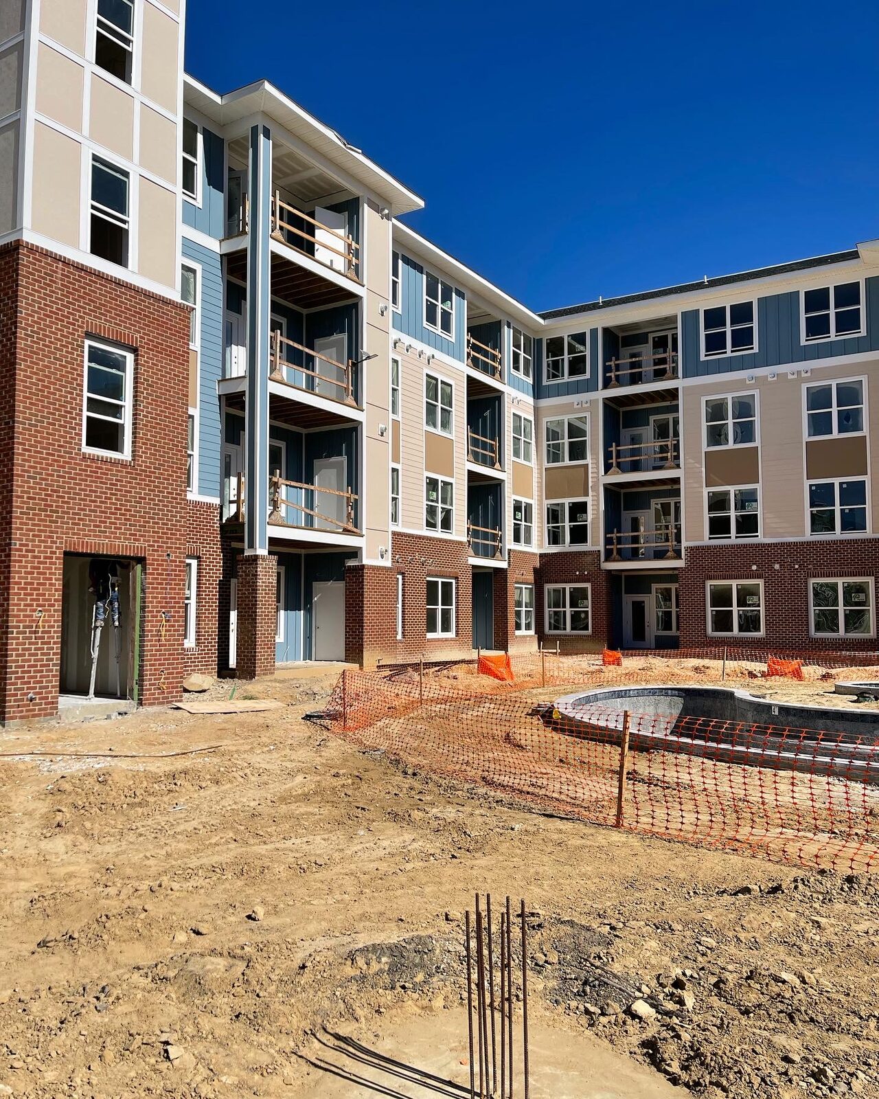A community pool being built at a Kaufman Development site
