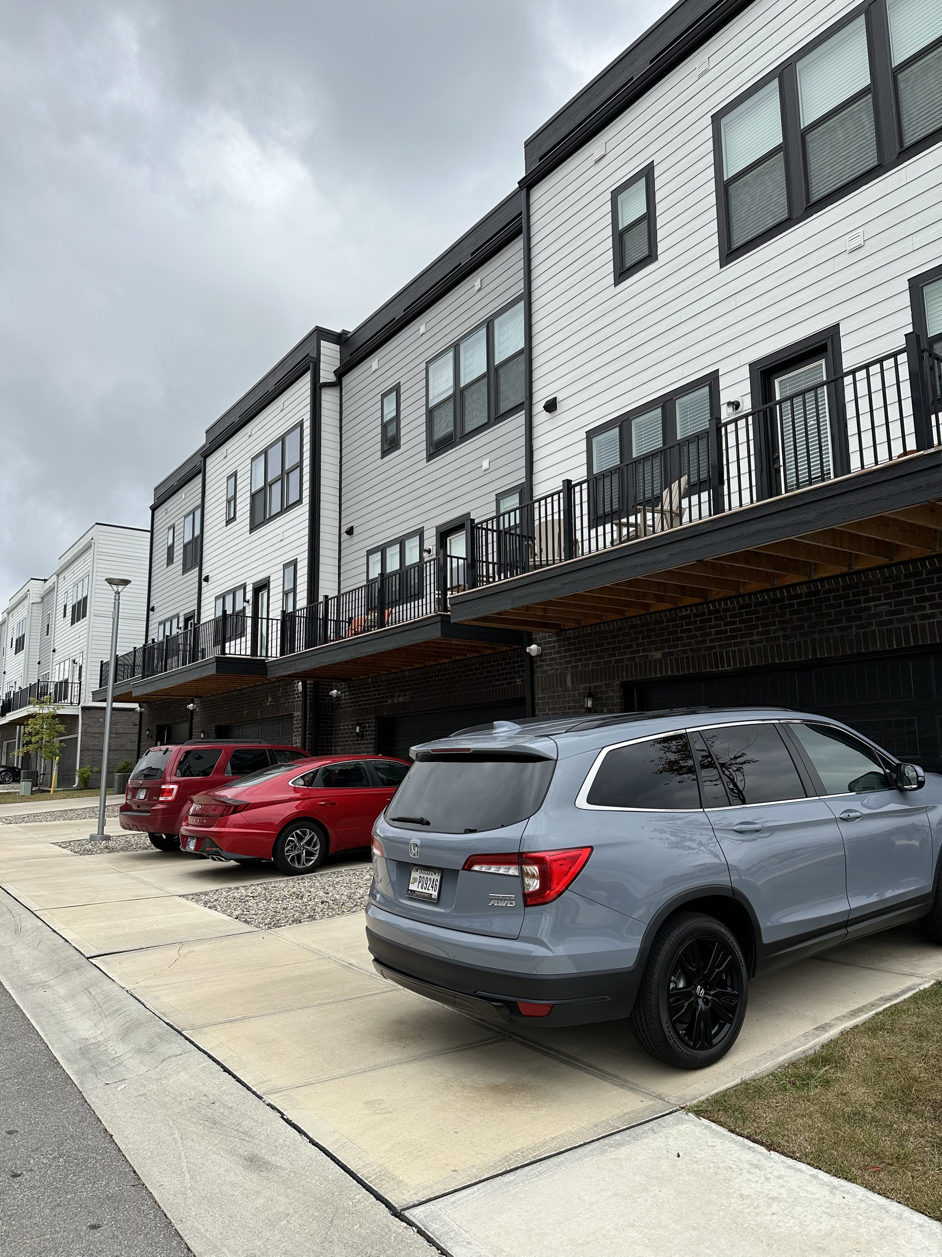 Lonestar Kaufman townhomes with balconies above ground-floor garages