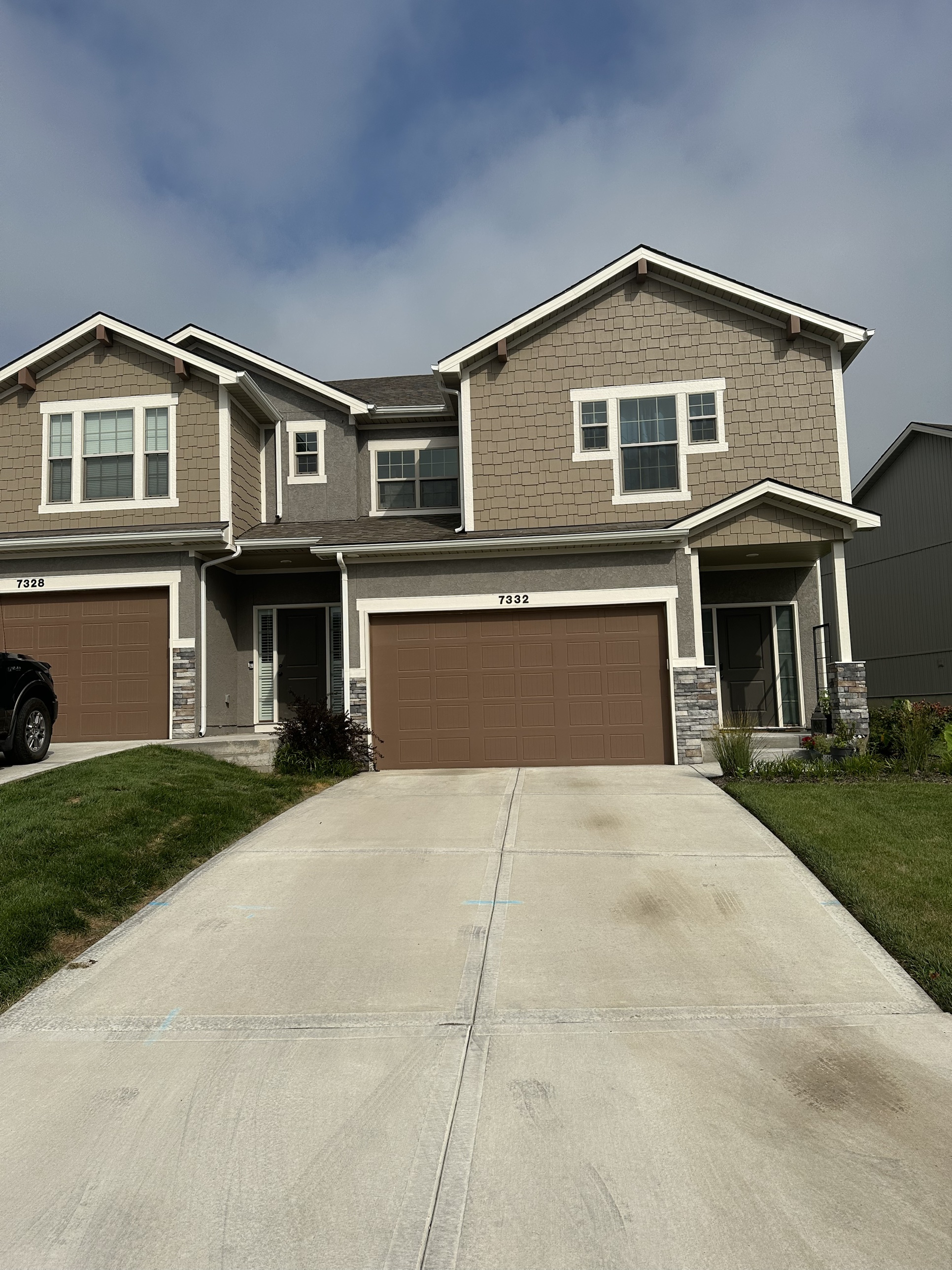 Front entrance and driveway of a completed Lonestar Kaufman townhome