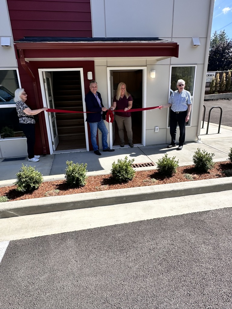 Ribbon-cutting ceremony celebrating the completion of an Oldivai Project Zero workforce-housing community