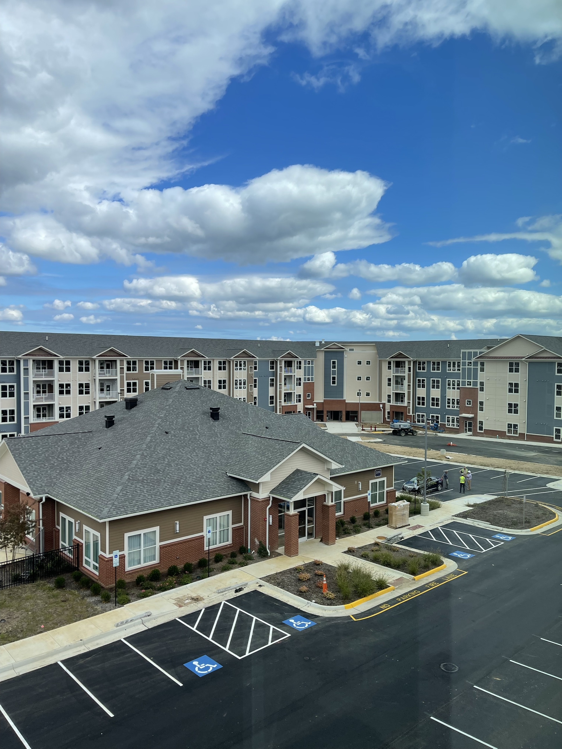 An aerial view of a clubhouse and apartment community in a Prophesy Capital target market
