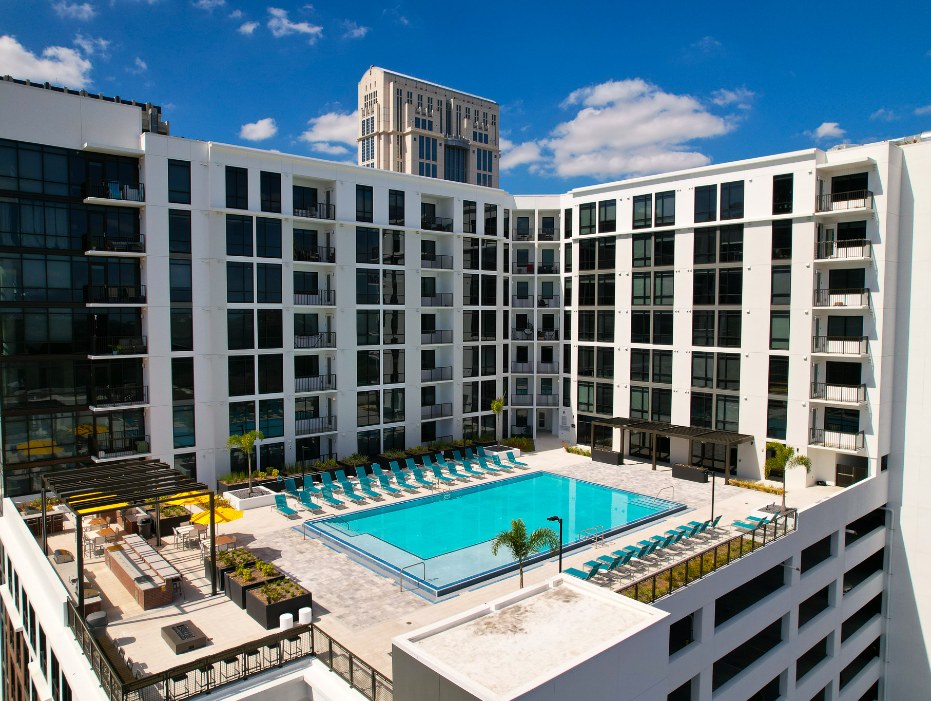 Twilight view of the resort-style pool at Radius Orlando in Downtown Orlando’s Lake Eola Heights neighborhood