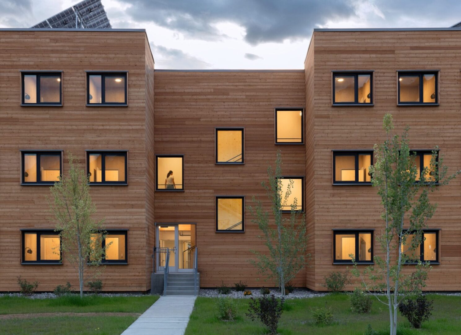 Three-story building with lit windows