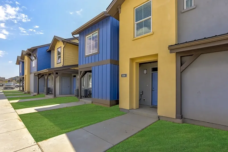 Contemporary townhouses with blue and yellow exteriors